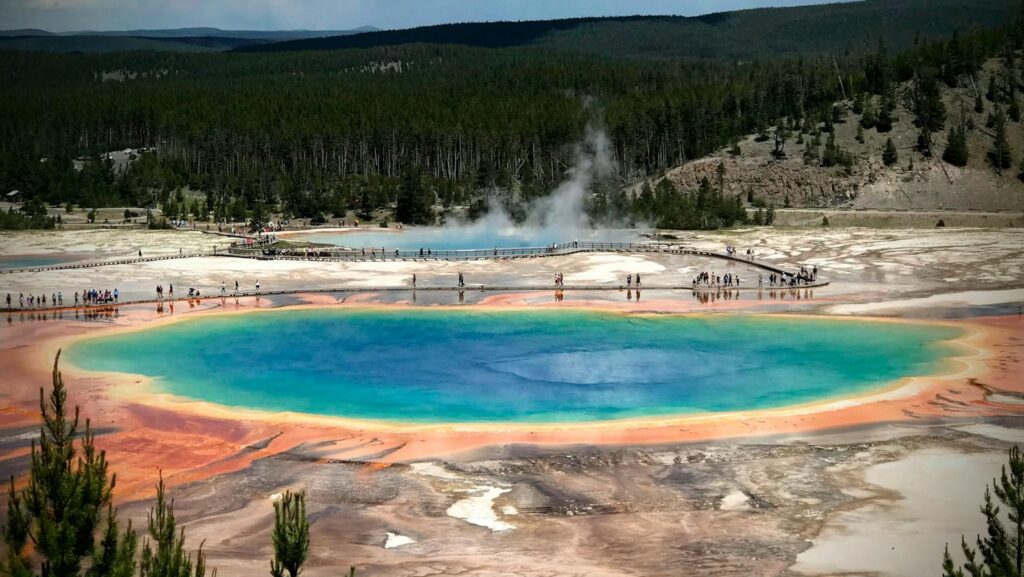 Aerial view of the vibrant Grand Prismatic Spring in Yellowstone National Park showcasing colorful geothermal features.
