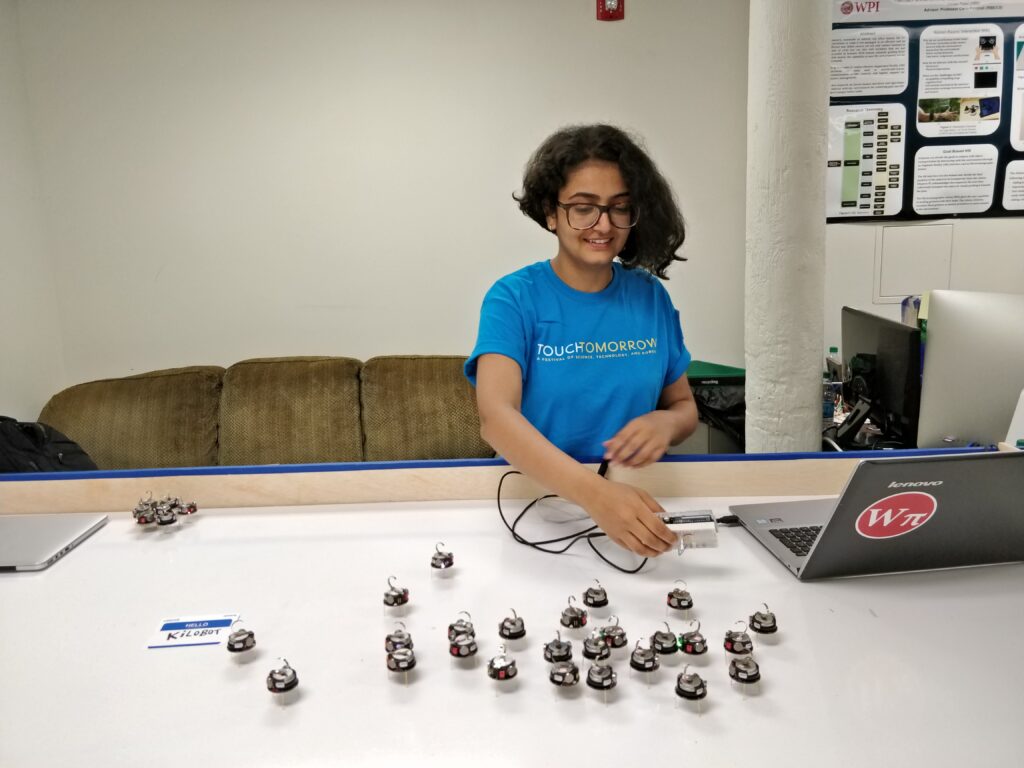 Kilobots on a white table.
