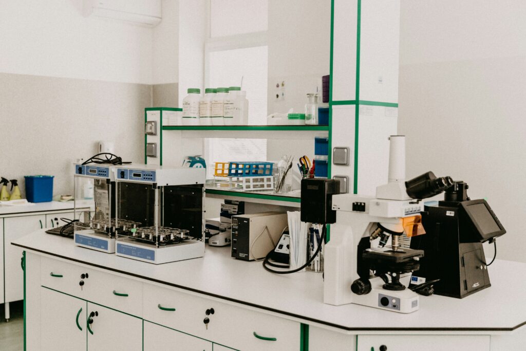 Scientist observing orchid mantis under lab conditions