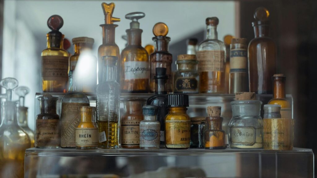 Collection of vintage apothecary bottles showcasing historical pharmaceutical storage.