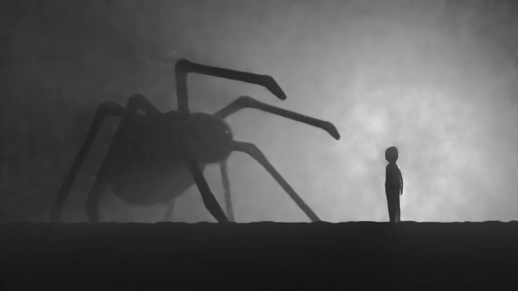 A person standing in front of a giant spider