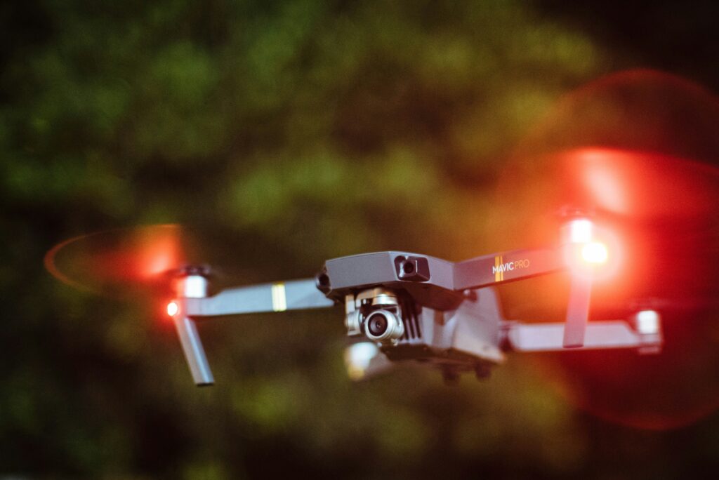 Silhouette of a robotic bug with question marks and privacy icons in the background