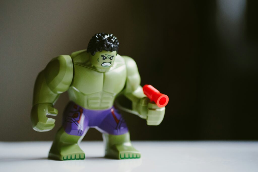 Cartoon-style hero in green bug costume breaking the fourth wall