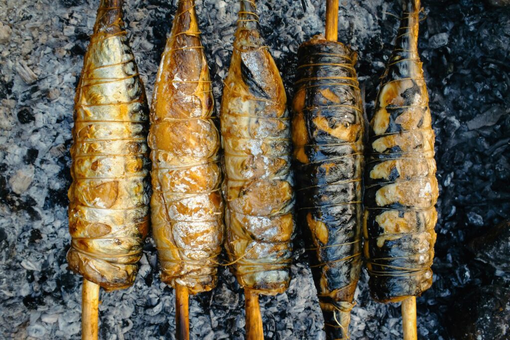 Local street food vendor frying insects in a wok