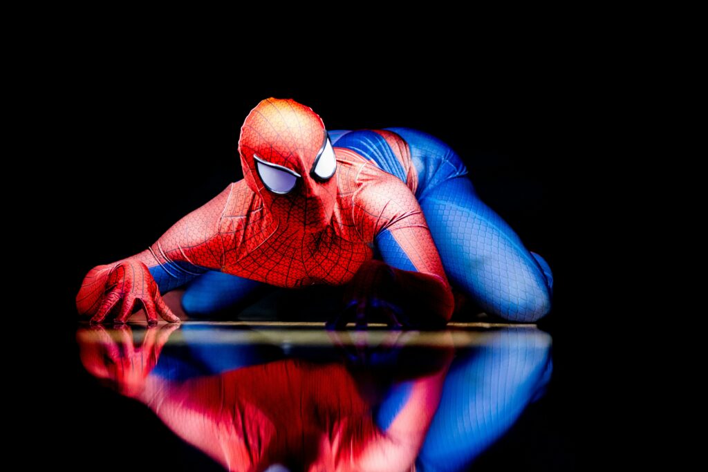 Spider-Man scaling a wall using spider-like micro hairs on his hands and feet
