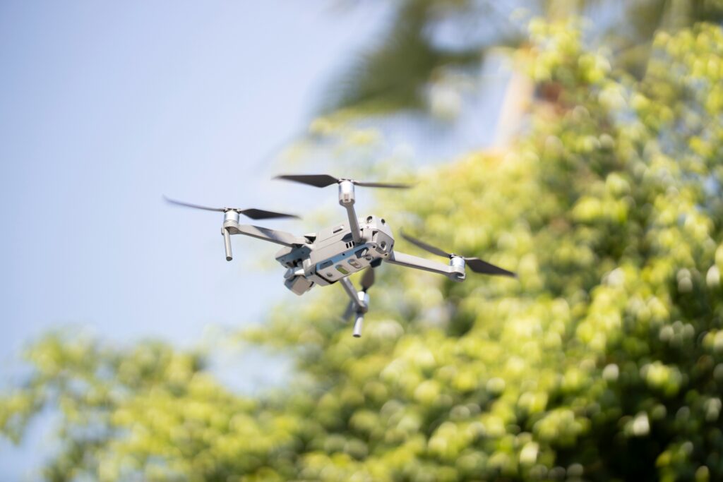 Robotic bee pollinating a flower in a greenhouse environment