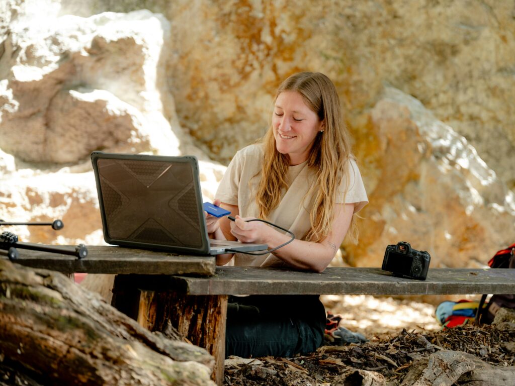 Scientist or graduate student recording cave spider data