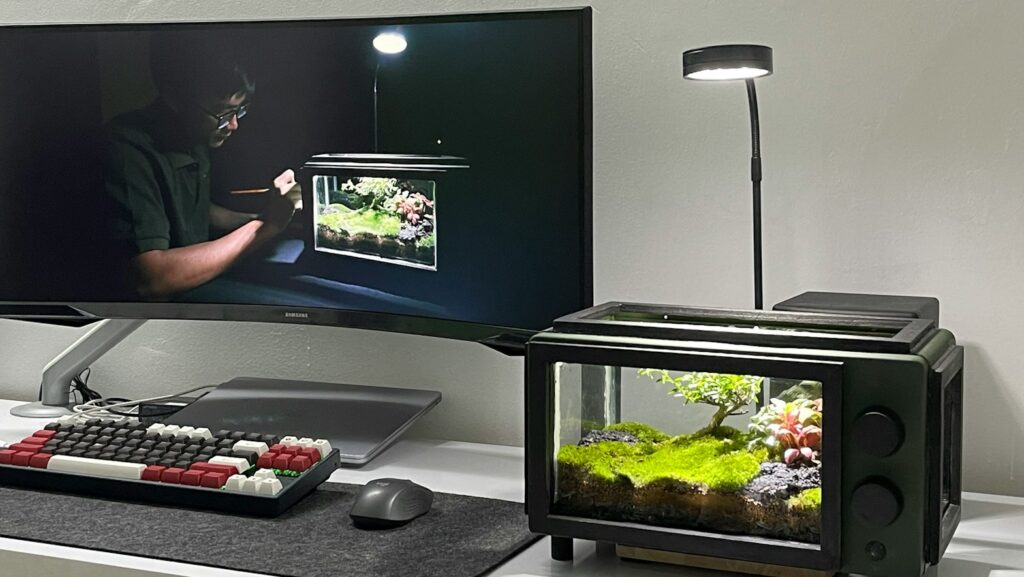 a flat screen tv sitting on top of a desk
