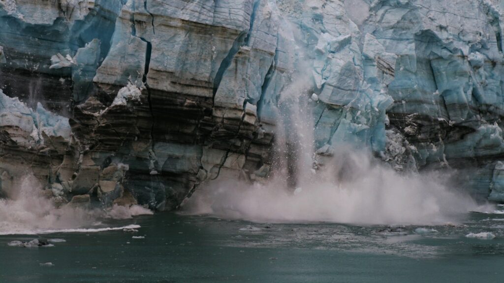 water splash on brown rock formation during daytime