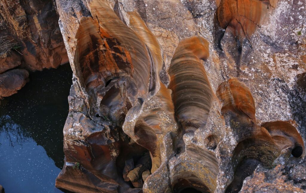 An aerial view of a rock formation with water in it
